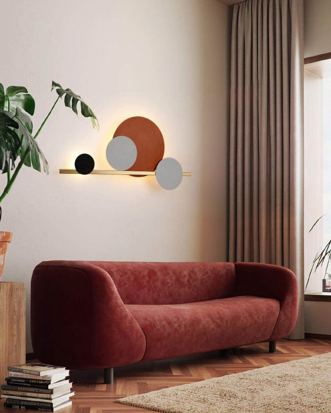 Modern 4 Circle LED wall sconce lighting above a red sofa, adding accent wall lighting to a stylish living room.