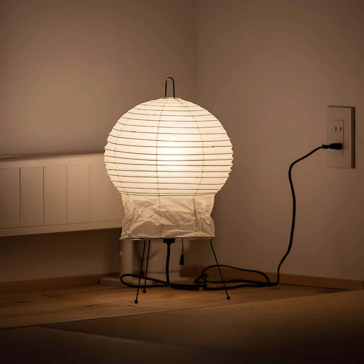 Akari 2N Table Lamp featuring a white, round design, perfectly blending Japandi and Art Deco styles for elegant accent lighting.