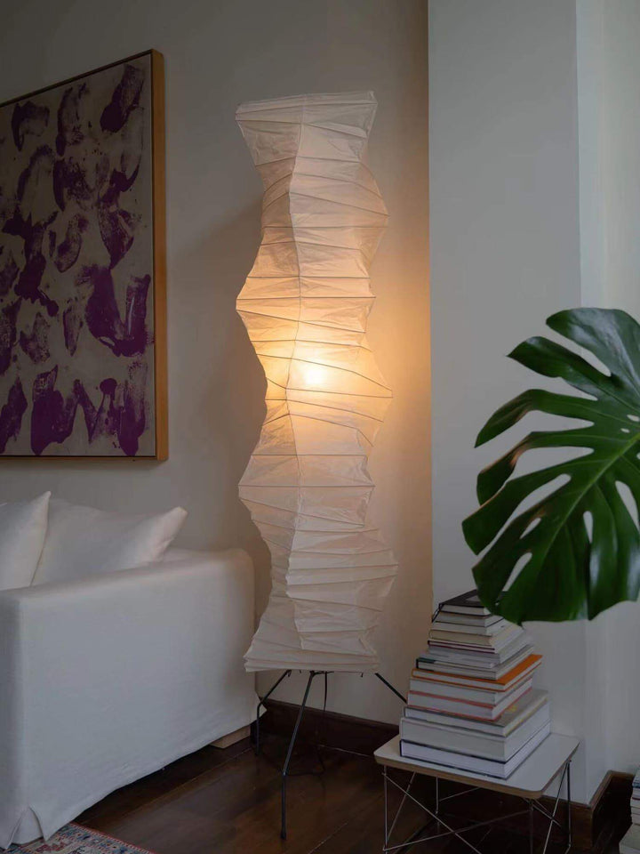 Elegant Akari UF4-33N white rice paper floor lamp in minimalist design, illuminating a cozy living space.