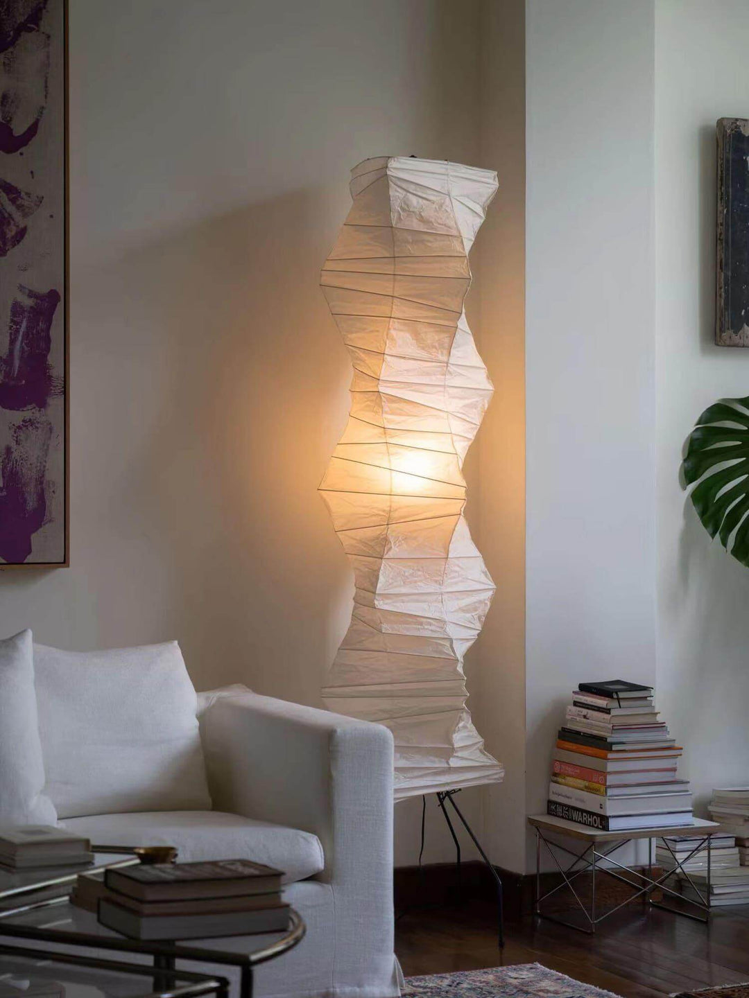 Akari UF4-33N white rice paper floor lamp in minimalist design, enhancing a cozy living room atmosphere.