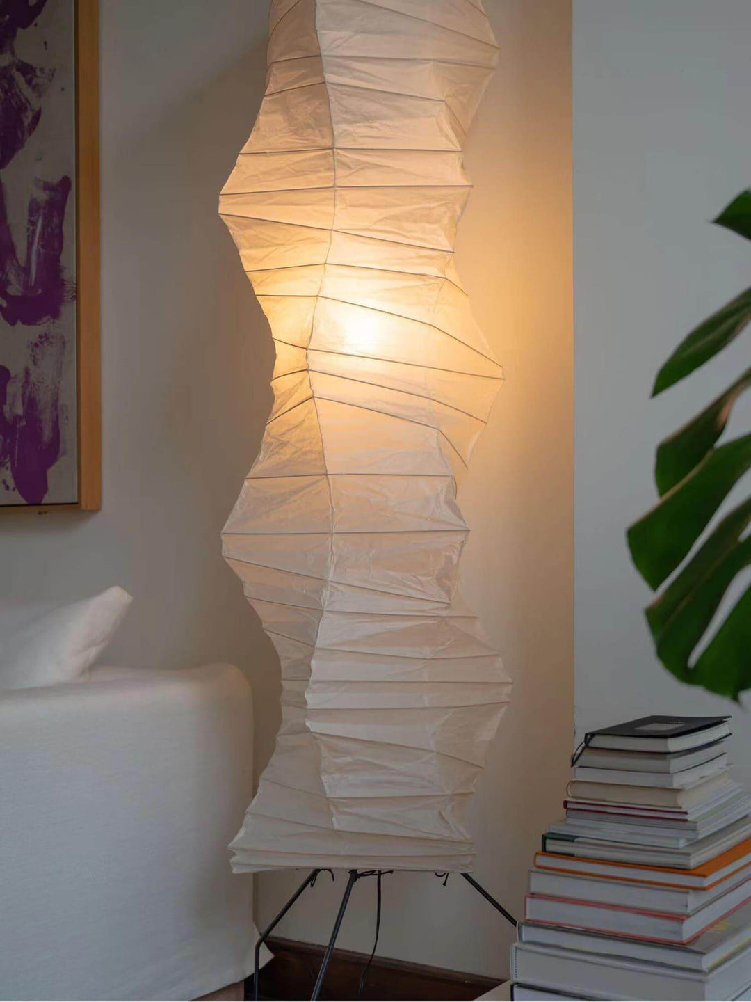Akari UF4-33N white rice paper floor lamp, minimalist Japanese design, illuminating cozy living space.