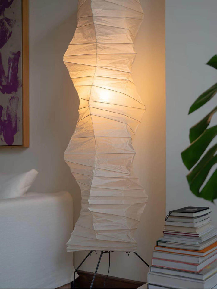Akari UF4-33N white rice paper floor lamp, minimalist Japanese design, illuminating cozy living space.
