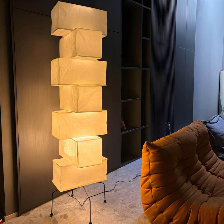 Akari UF4-L10 white rice paper minimalist floor lamp in modern interior, featuring a stacked lantern design.