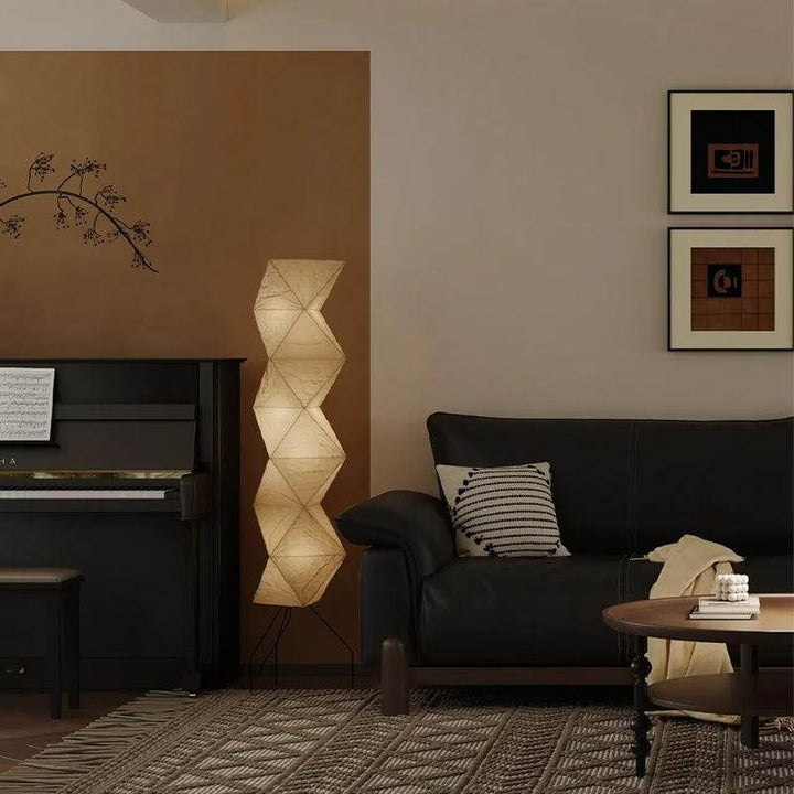 Stylish Akari UF4-L8 white rice paper floor lamp in a minimalist living room setting.