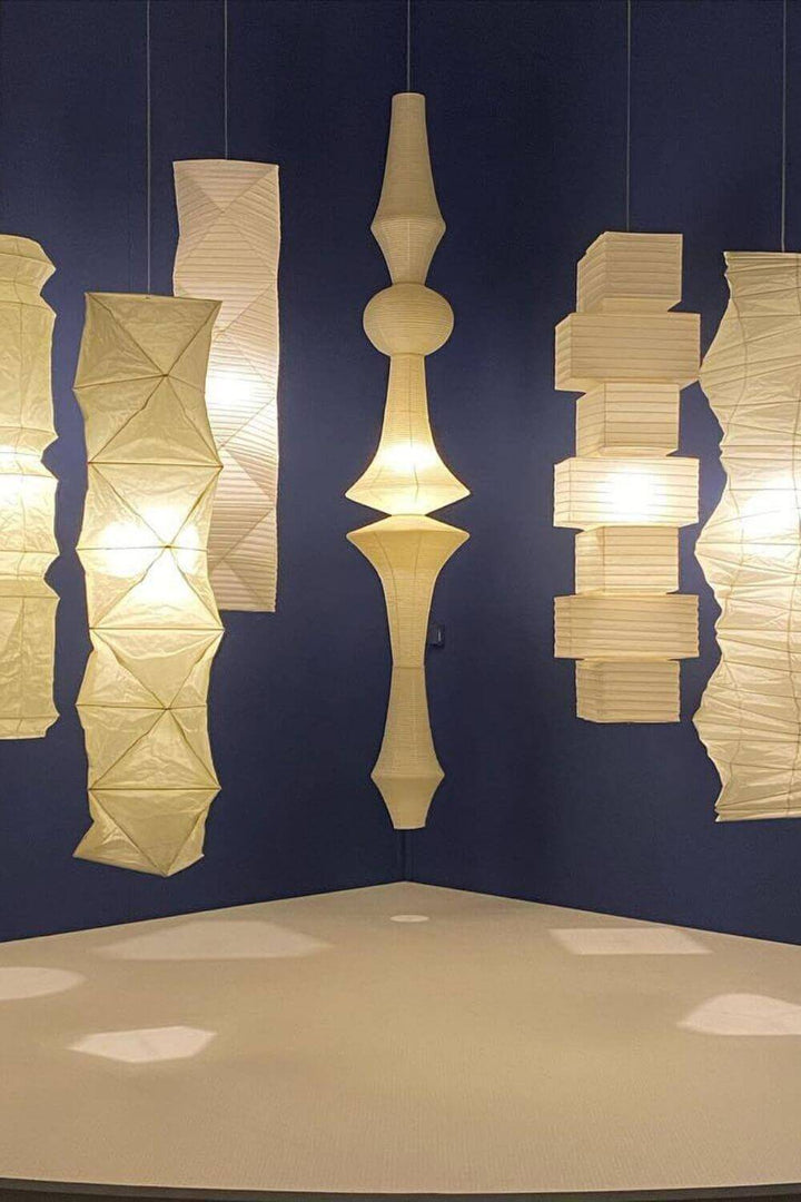 Collection of minimalist Japanese rice paper floor and lantern lamps in a modern setting.