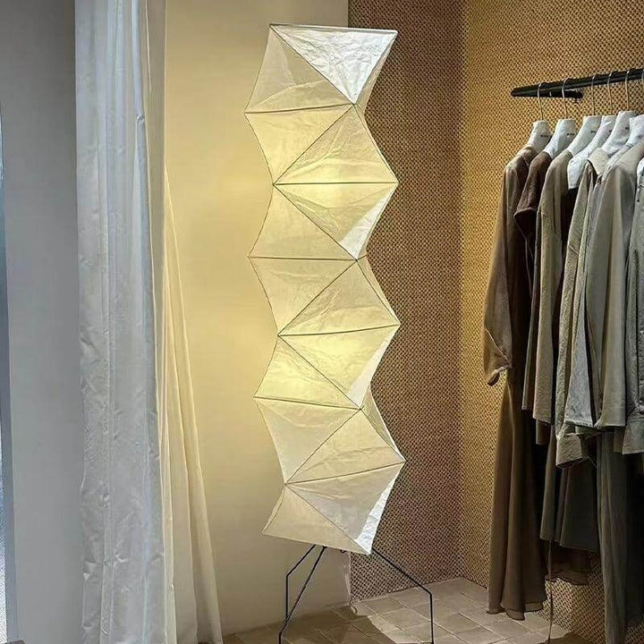 Akari UF4-L8 white floor lamp in a minimalist design, featuring rice paper and a unique lantern shape, ideal for modern decor.