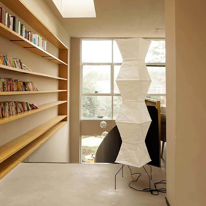 Akari UF4-L9 white rice paper floor lamp in minimalist design, tripod style, enhancing a bright modern interior.