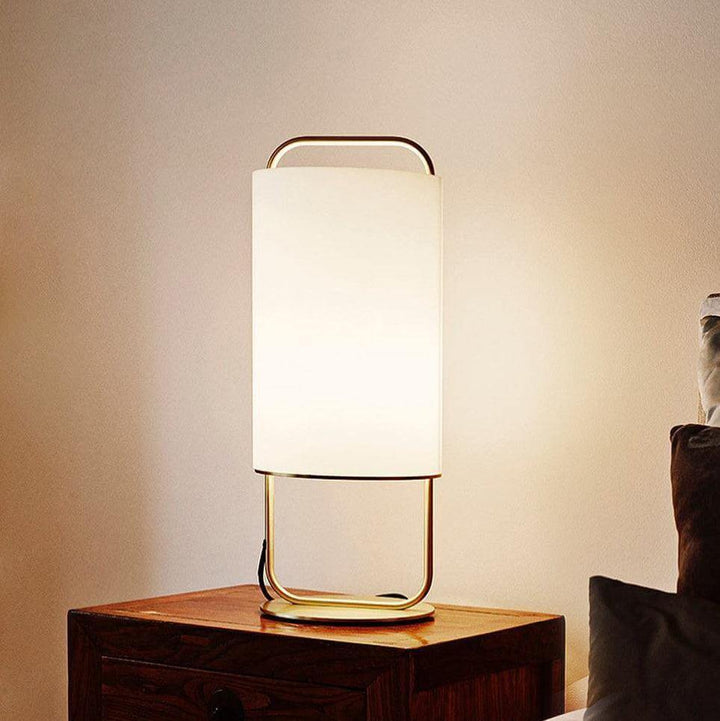 Elegant Alistair Table Lamp in white with a gold base, perfect for bedside lighting in a Japandi style.