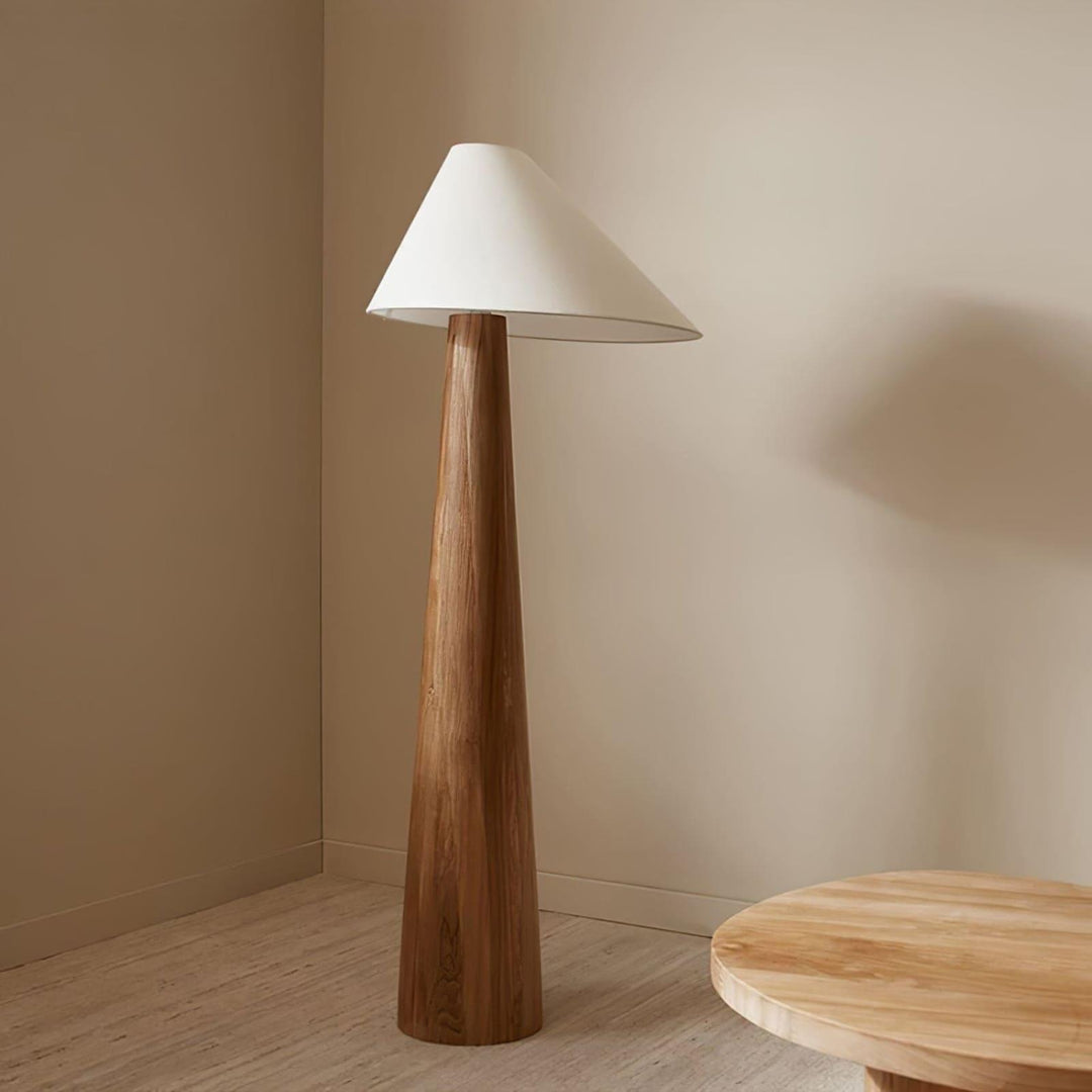 Alvin wooden floor lamp, retro farmhouse design with conical shade in a minimalist room setting.