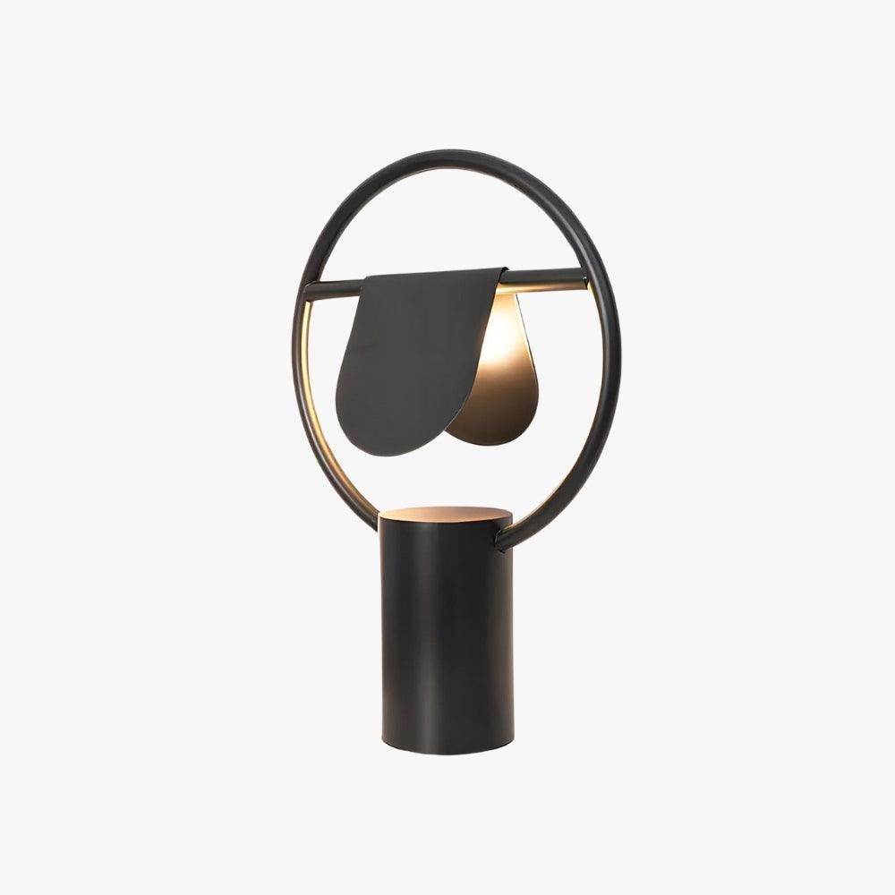 Modern Anae table lamp featuring art deco design, round shape, and black finish, perfect for bedside lighting.