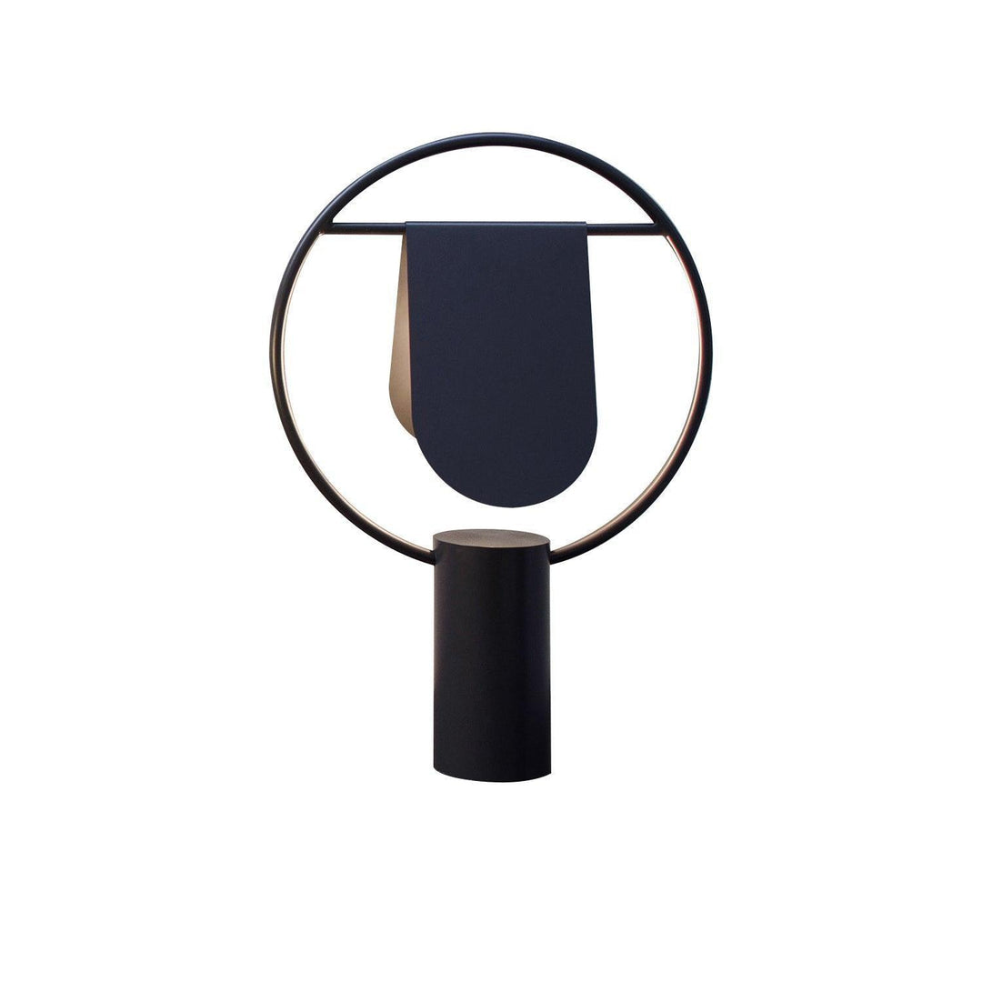 Modern Anae table lamp in art deco style, featuring a circular design and black finish, ideal for bedrooms.