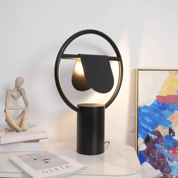 Modern Anae table lamp in art deco style with black finish, perfect for bedroom lighting and bedside decor.