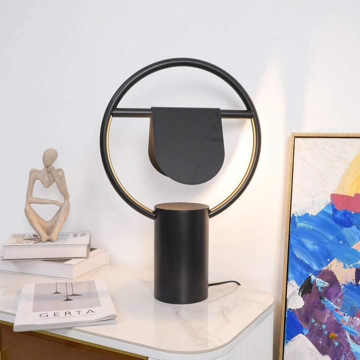 Modern black Anae table lamp with circular design, perfect art deco bedside lighting for stylish bedrooms.