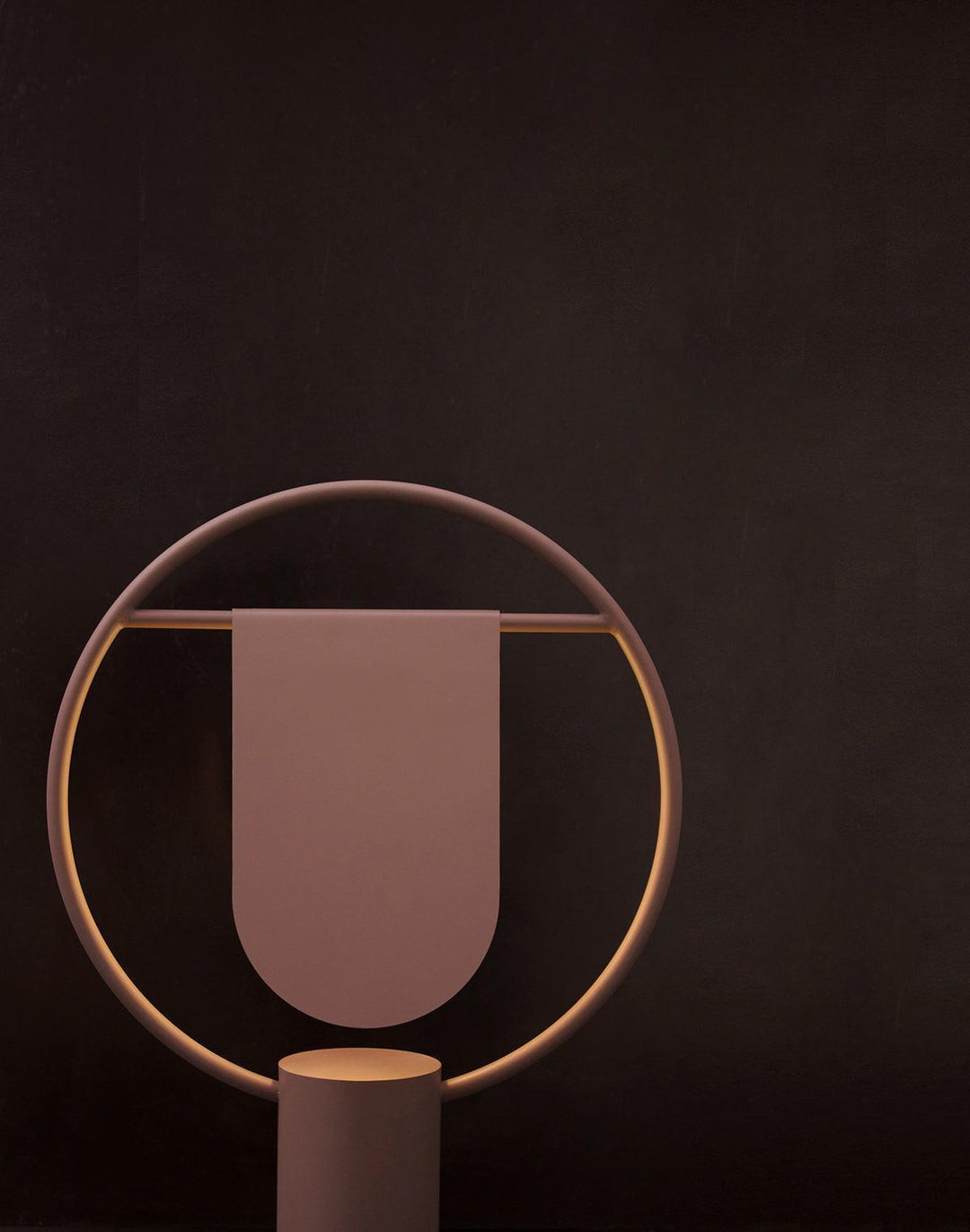 Anae Table Lamp in modern art deco style, featuring circular shape and a sleek design, perfect for bedside use.