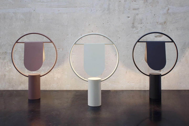Modern table lamps featuring minimalist design in three colors, perfect for stylish interior decor.