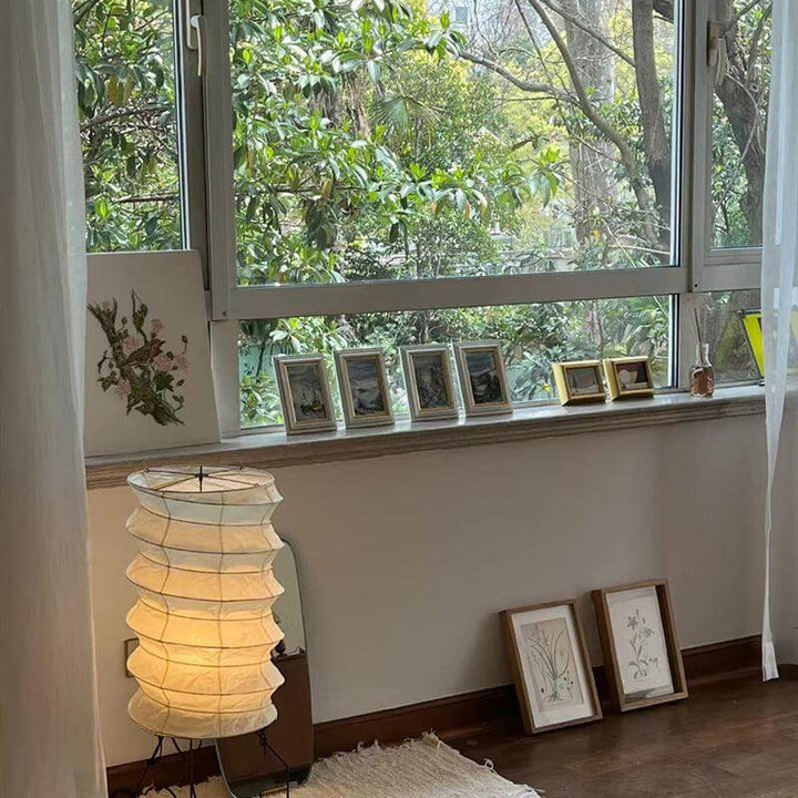 Washi Paper UF2-31N tripod table lamp in a modern living room, enhancing the Japandi aesthetic with soft lighting.