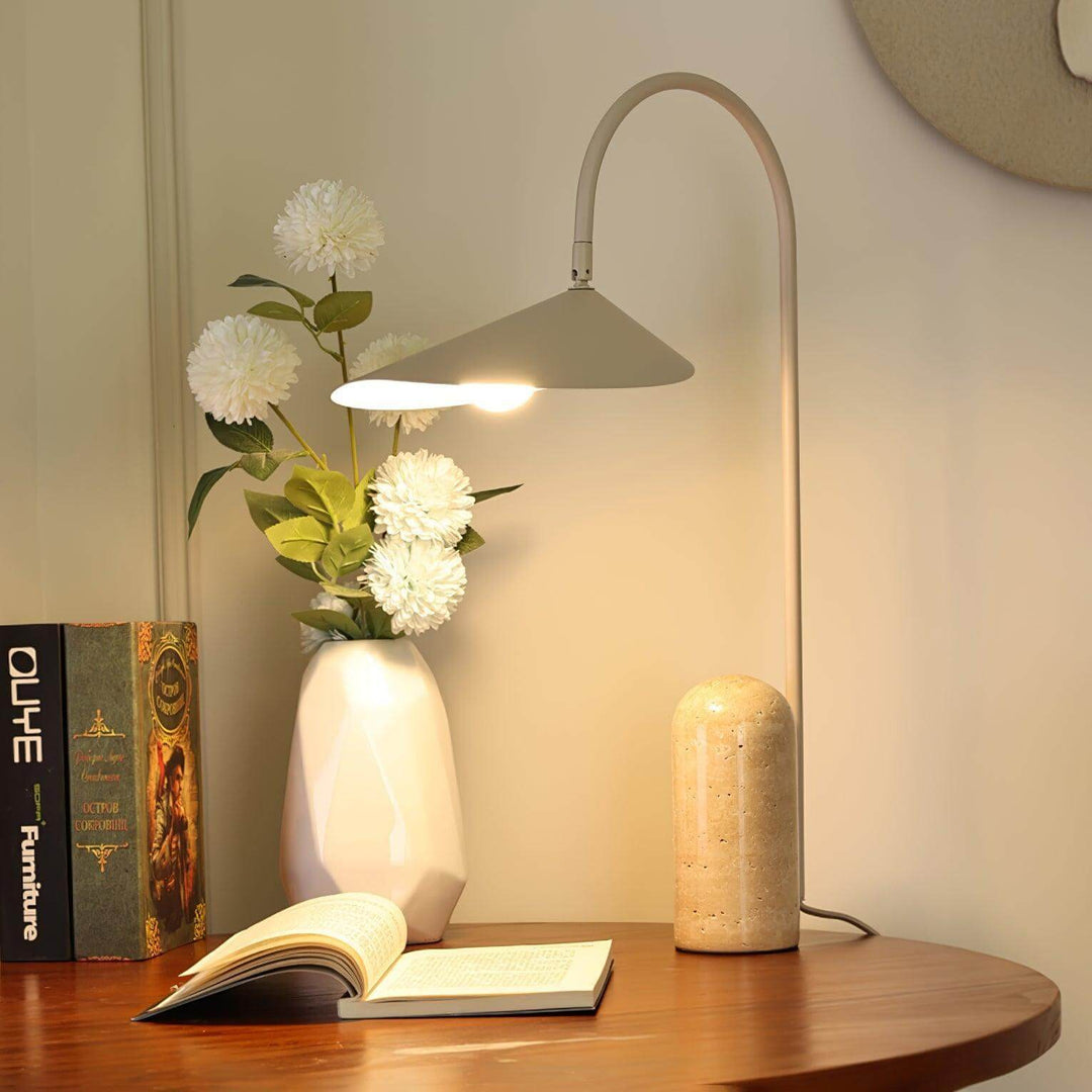 Arum marble table lamp on wooden desk with flowers and books, ideal for modern office or living room decor.