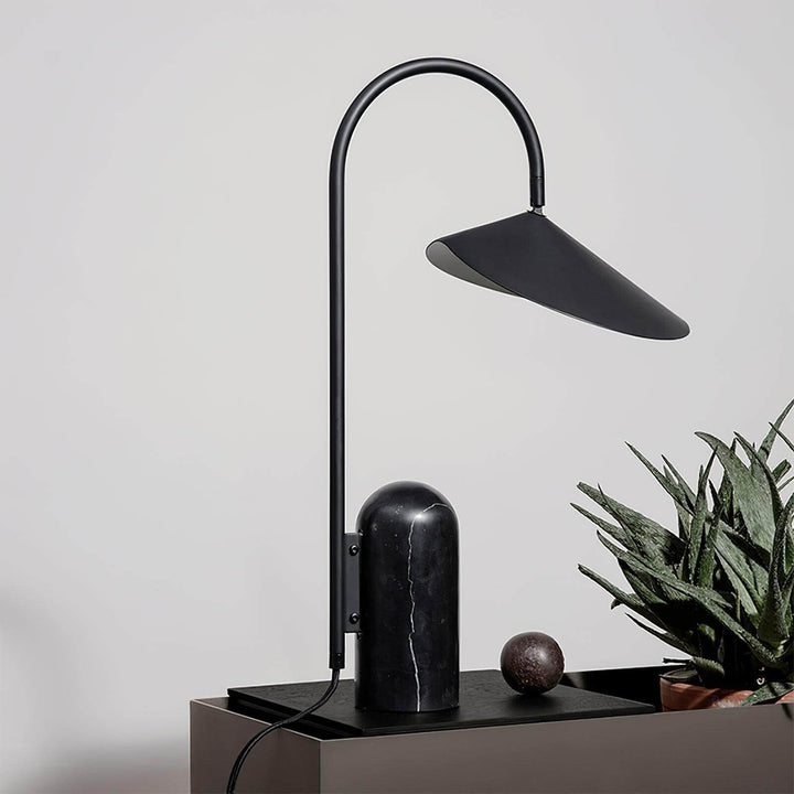 Stylish Arum marble table lamp in black, perfect for office and modern living room decor.