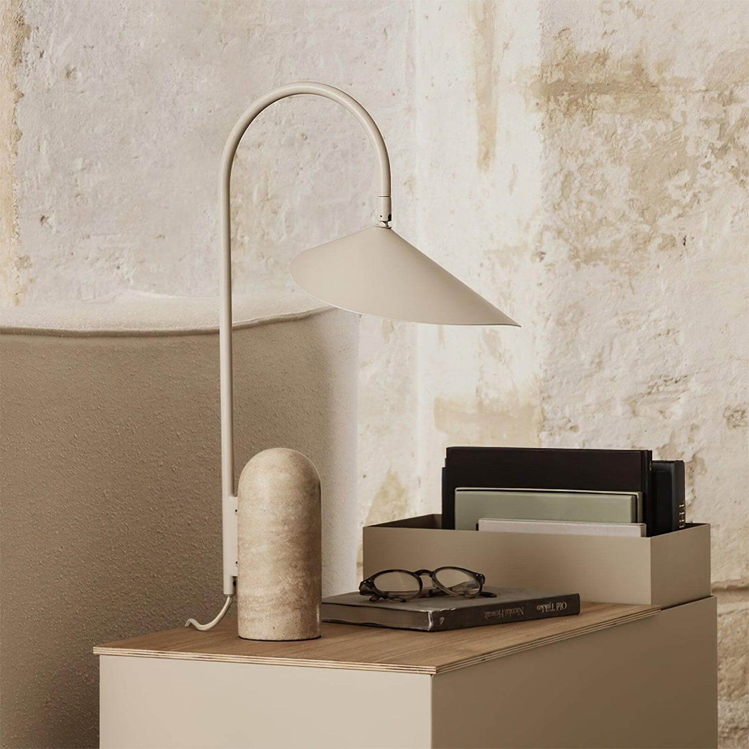 Arum Table Lamp on a wooden desk, showcasing a modern design with a marble base, ideal for office or living room.