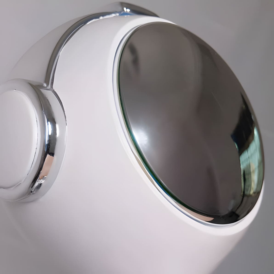 Close-up of the Astrolux Floor Lamp showcasing its sculptural design and reflective chrome accent.