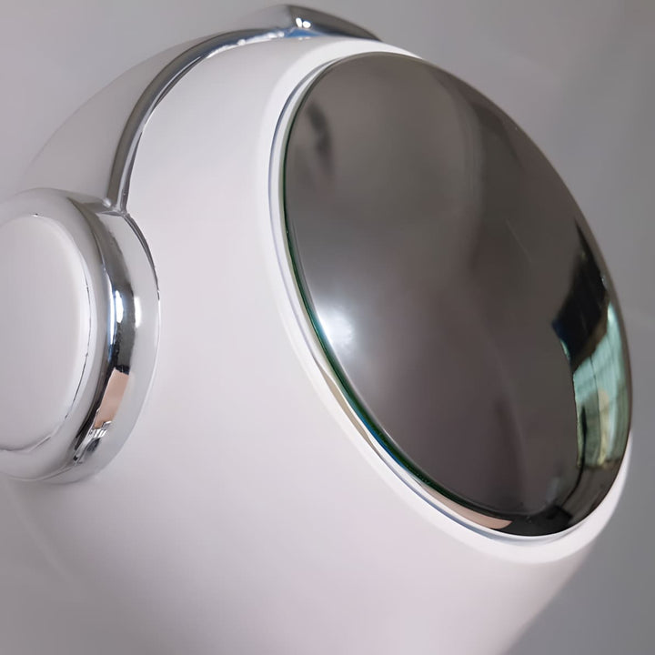 Close-up of the Astrolux Floor Lamp showcasing its sculptural design and reflective chrome accent.