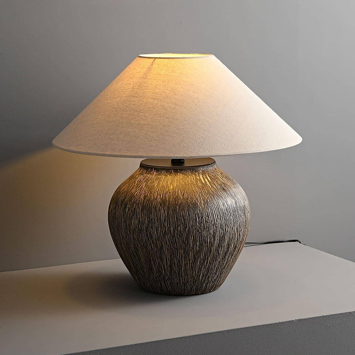 Stylish Bayi ceramic table lamp with a textured base and soft white shade, perfect for vintage sofa table decor.