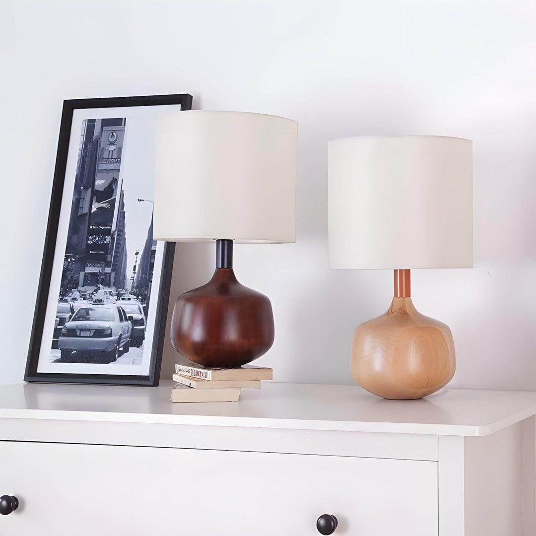 Stylish Bethel Table Lamps in wood, mid century modern and Japandi design, displayed on a white dresser with books and a photo.