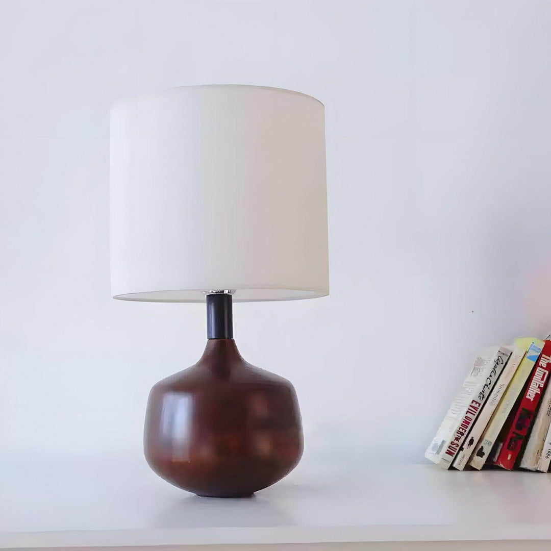 Stylish wood table lamp with a brown base and white shade, perfect for mid century modern and Japandi decor.