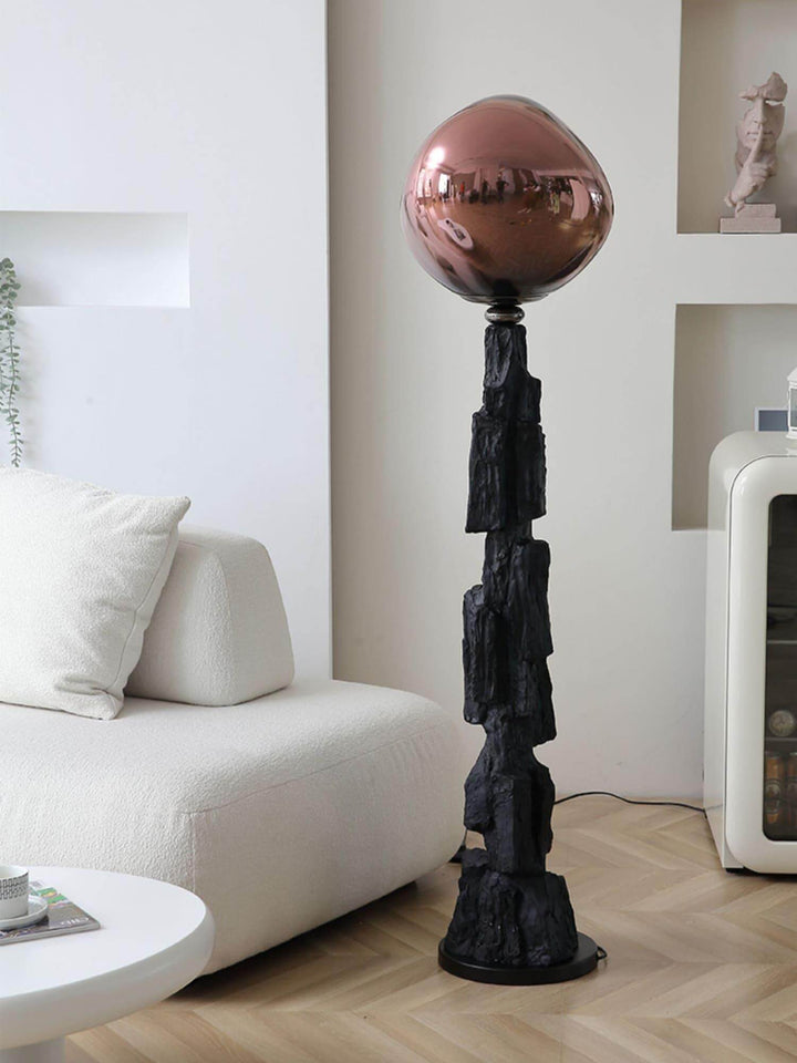 Unique charcoal lava floor lamp with a striking art deco design, featuring a glossy copper globe, perfect for modern interiors.