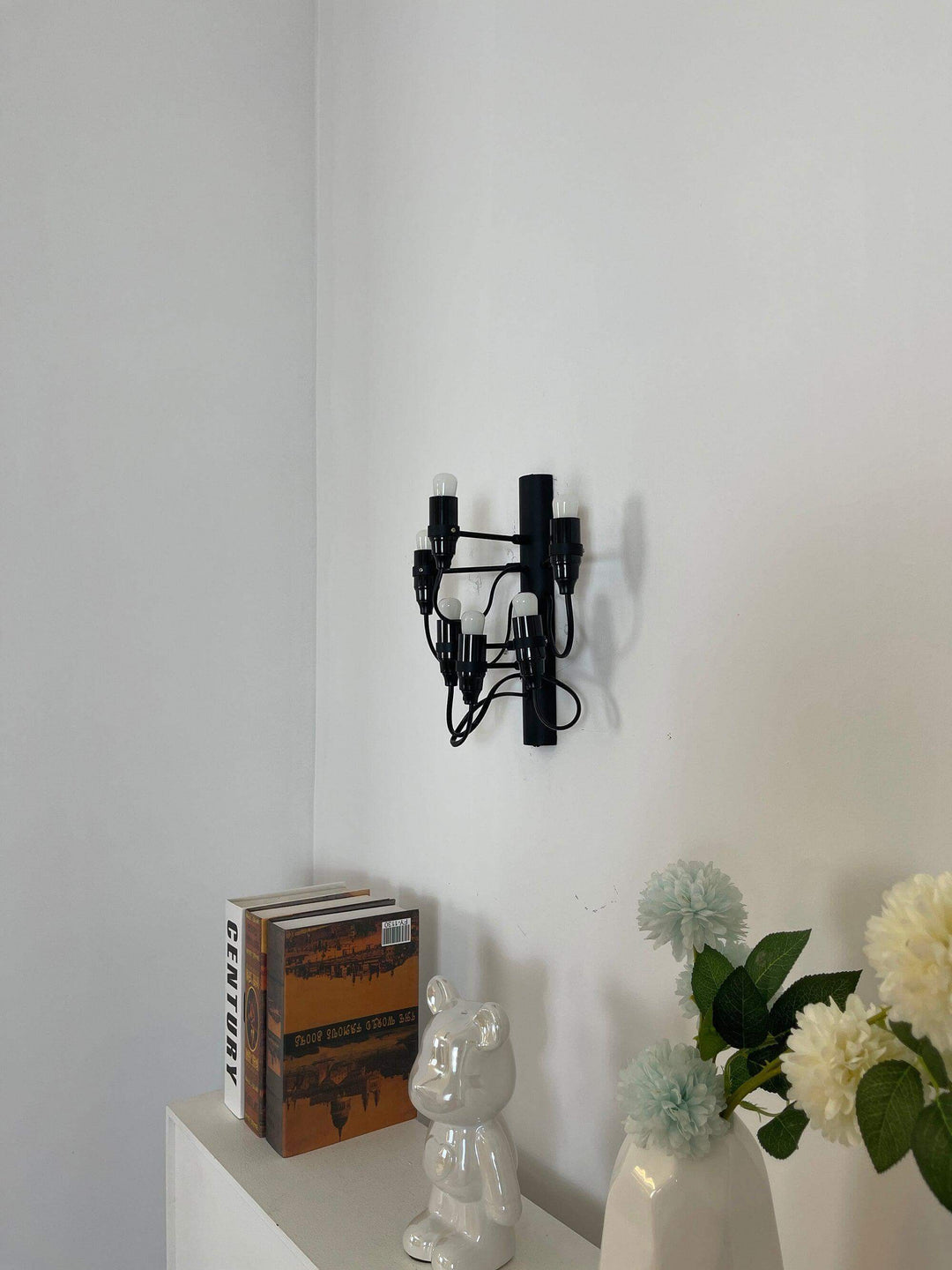 Classic 2097 mid century wall sconce on white wall, perfect wall lights for sitting or drawing room decor.