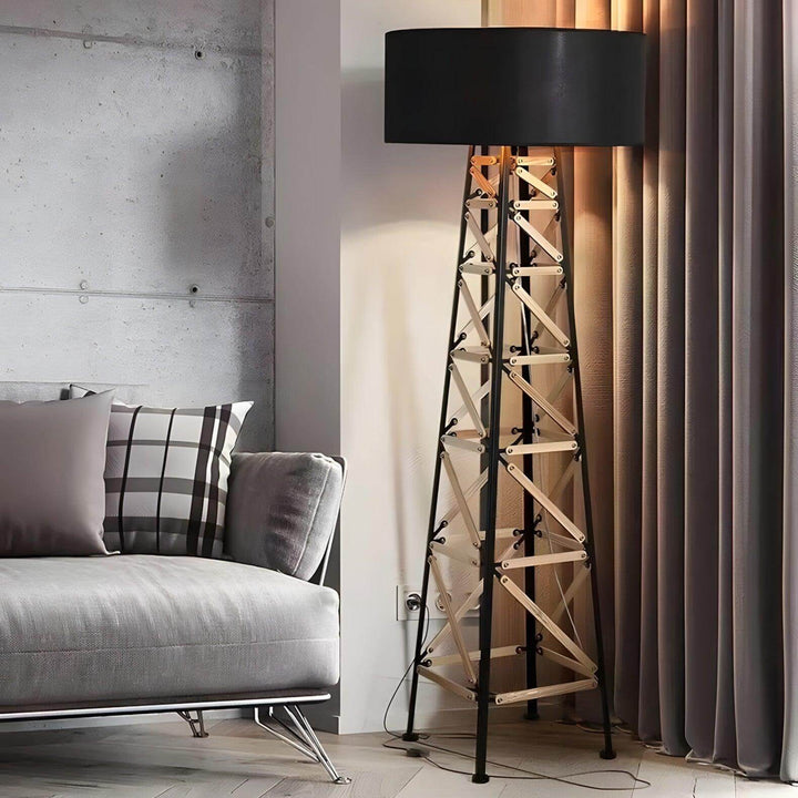 Funky Eiffel floor lamp in contemporary living room, featuring a metal base and stylish black shade, perfect for modern decor.