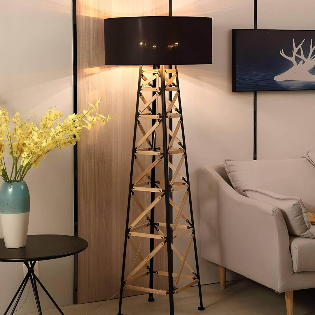 Unique metal floor lamp with a black shade, perfect for modern bedroom and living room decor.