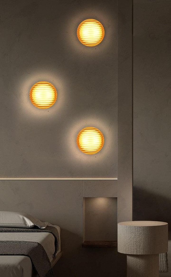 Vintage wall sconces set against a textured wall, perfect for hallway or bedroom lighting, showcasing a warm glow.