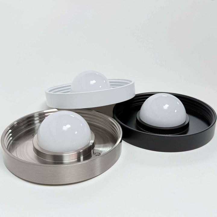 Three models of vintage wall sconces: nickel, matte white, and matte black options.