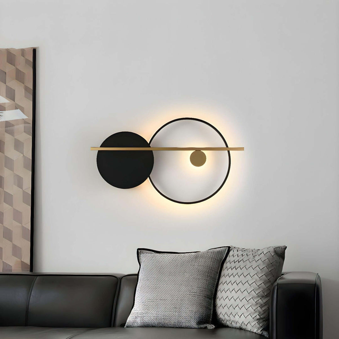 Modern double round wall light in black and gold, perfect as bedroom wall sconce or contemporary decor accent.