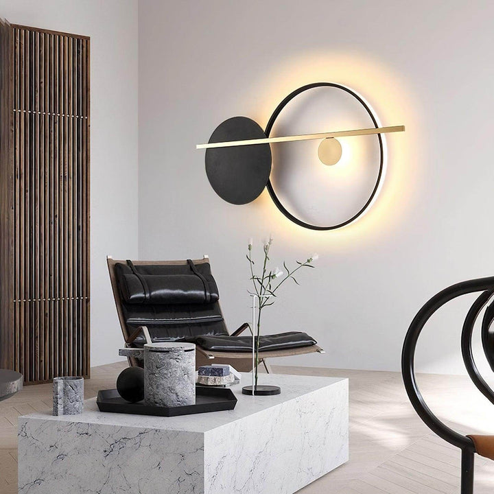 Modern double round wall light in black, adding elegant ambiance to a contemporary living space.