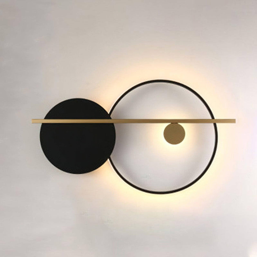 Modern double round wall light featuring a black sconce and gold accents, perfect for stylish bedroom lighting.