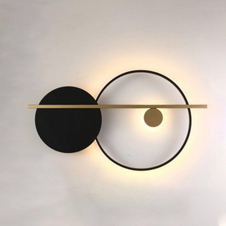 Modern double round wall light featuring a black sconce and gold accents, perfect for stylish bedroom lighting.