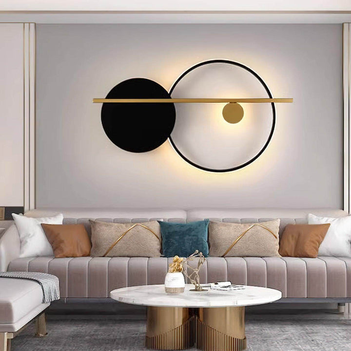 Modern black wall sconce with circles, perfect for bedroom lamps on wall. Stylish illumination for contemporary decor.