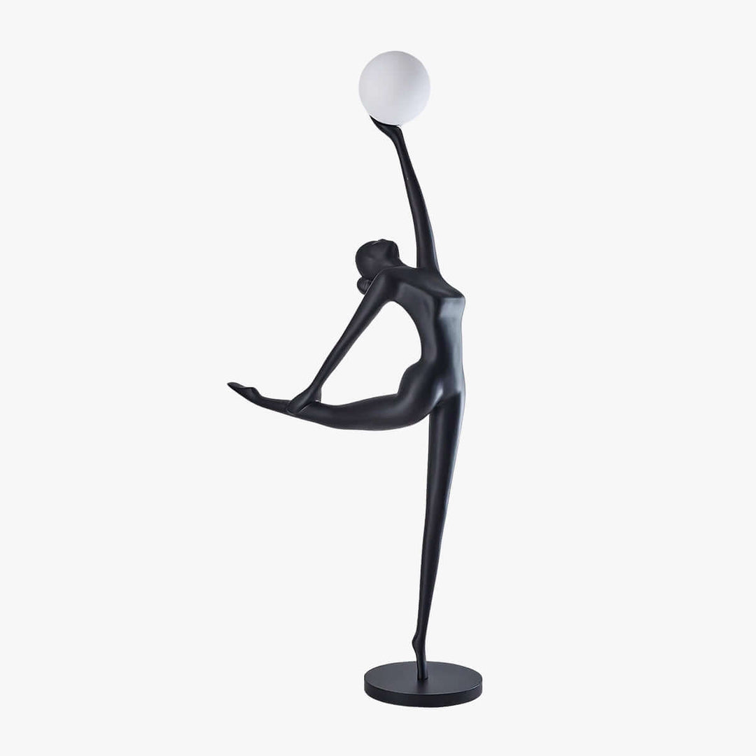 Sculptural floor lamp in the shape of a dancer holding a spherical light, perfect for modern living room decor.