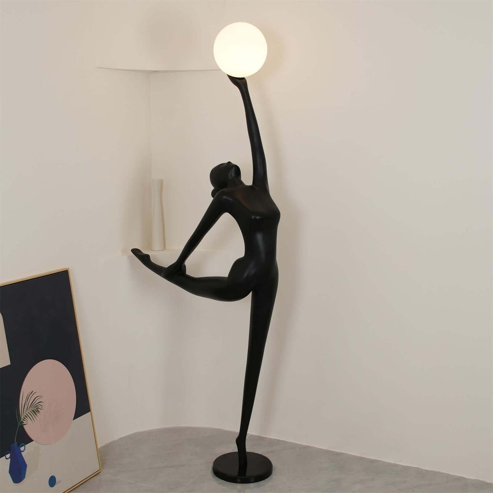 Sculptural art deco floor lamp in black, perfect for modern living room decor, featuring a round light globe.