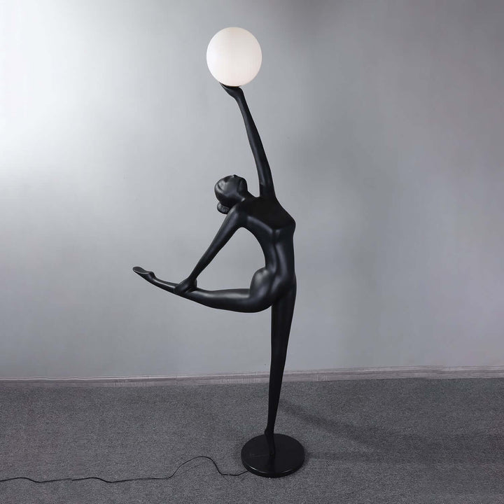 Sculptural art deco floor lamp in a black figure design, perfect for stylish living room lighting.
