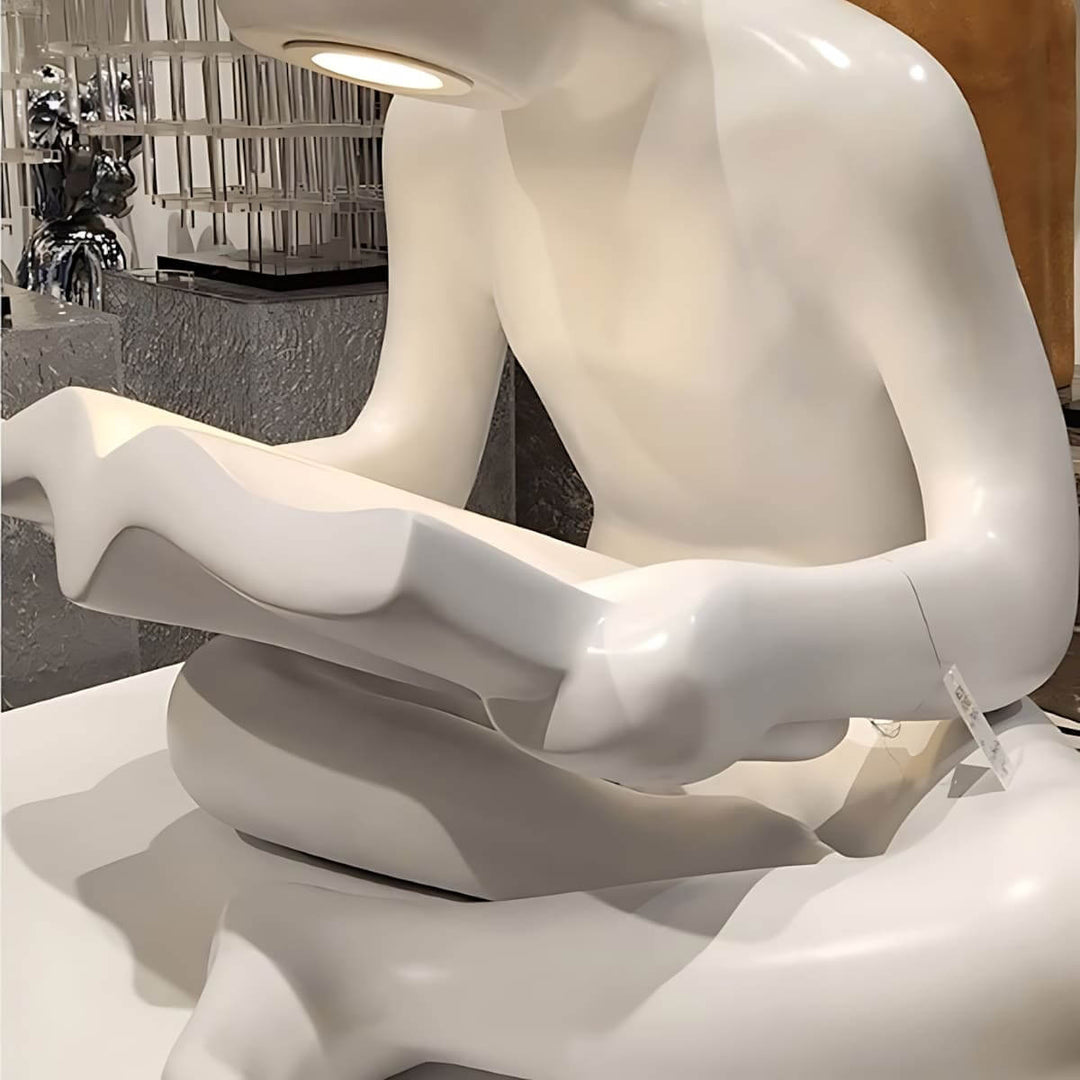 Elyvia art deco sculptural floor lamp featuring a white figure reading a book, perfect for living room lighting.