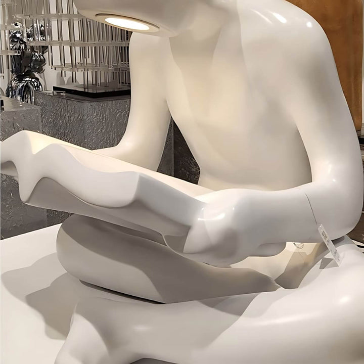 Elyvia art deco sculptural floor lamp featuring a white figure reading a book, perfect for living room lighting.