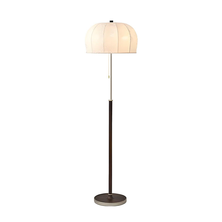 Gorra Floor Lamp in mid-century style, a skinny wood floor light with a cream shade, ideal for farmhouse decor.