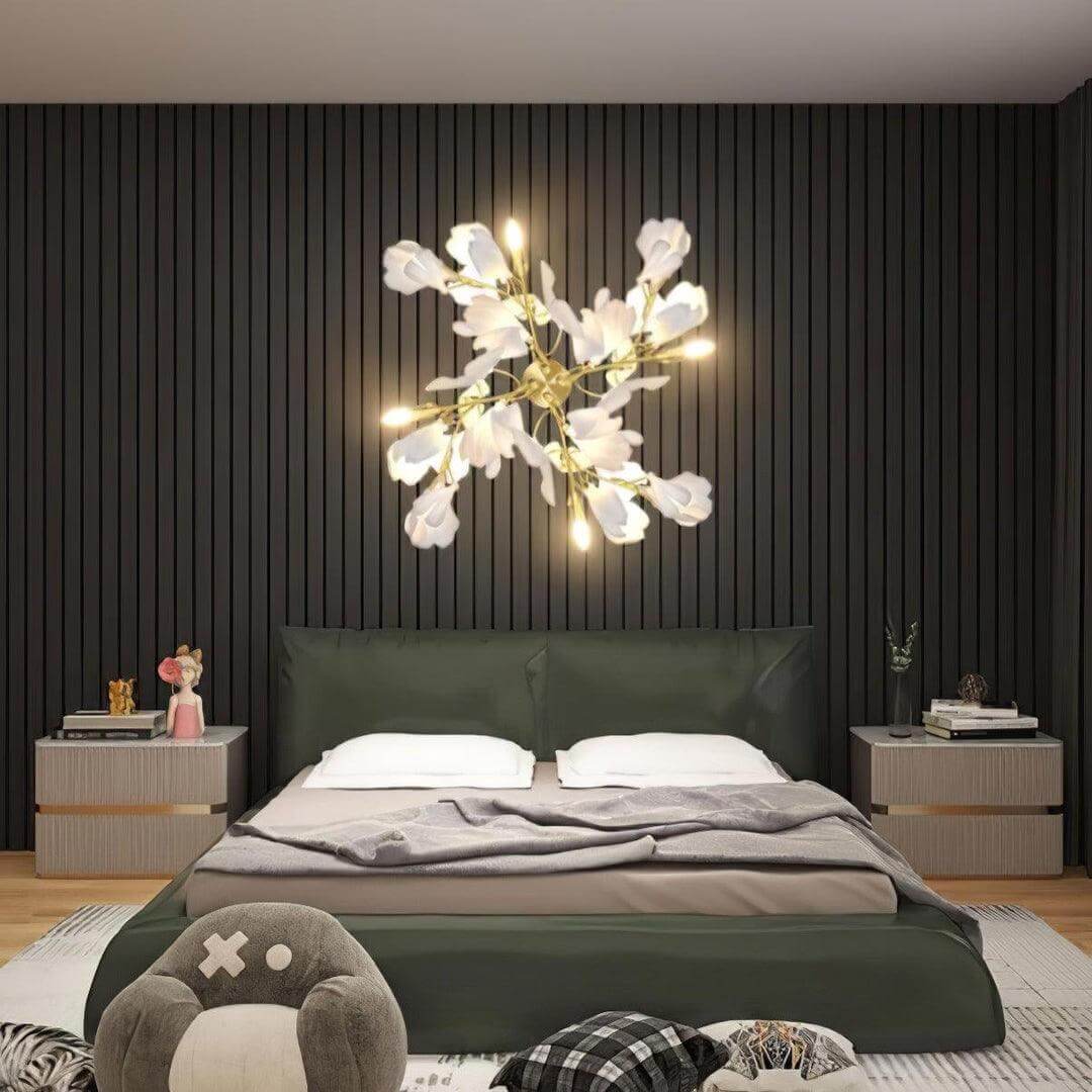 Ceramic wall sconce with gingko flower design over a modern bed, perfect for living room wall lighting.