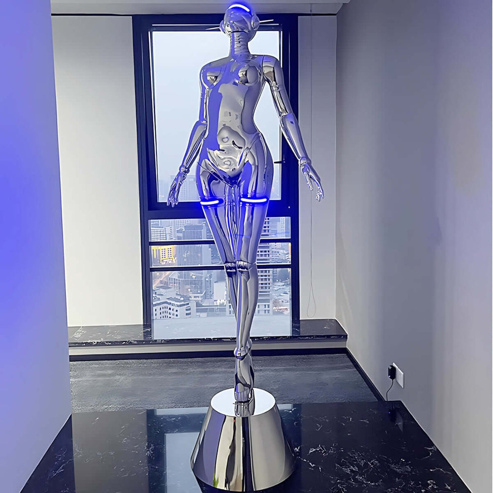 Sculptural silver floor lamp resembling a mannequin, featuring blue LED lights, perfect for modern decor.