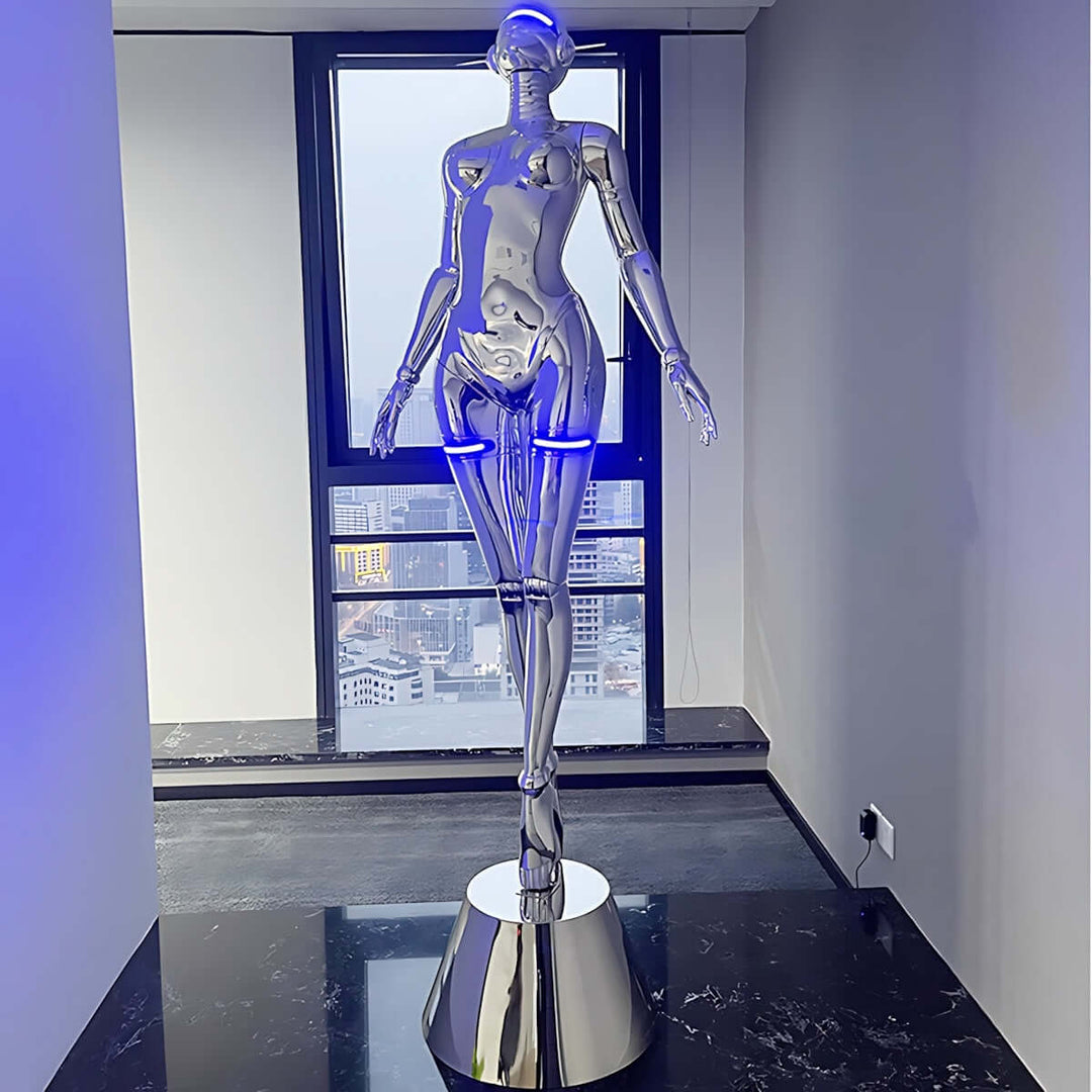 Sculptural silver floor lamp resembling a mannequin, featuring blue LED lights, perfect for modern decor.