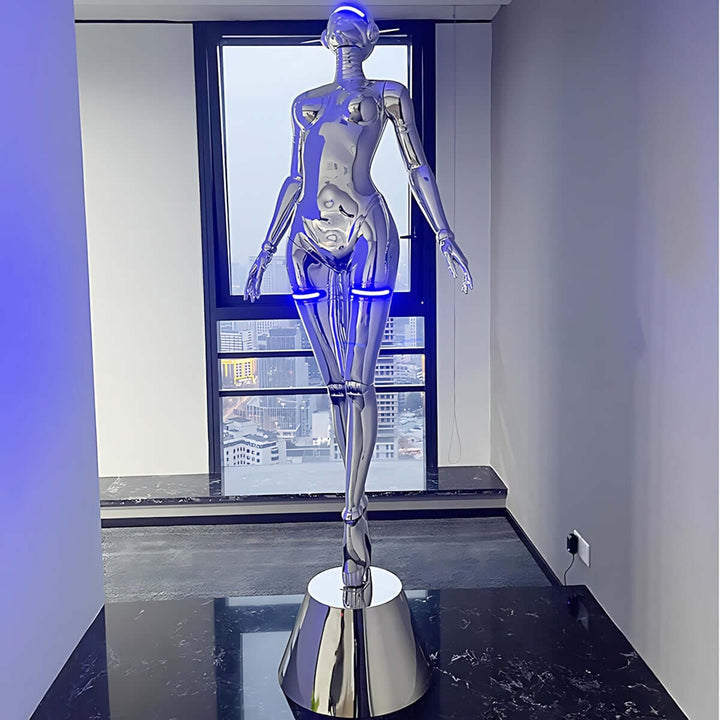 Sculptural silver floor lamp resembling a mannequin, featuring blue LED lights, perfect for modern decor.