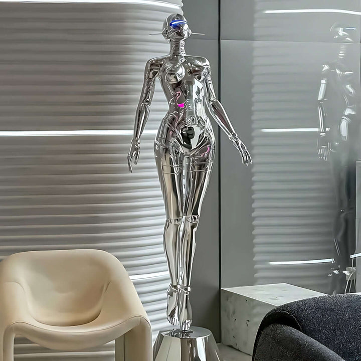 Sculptural floor lamp featuring a glossy silver humanoid design, perfect for modern art deco living room decor.